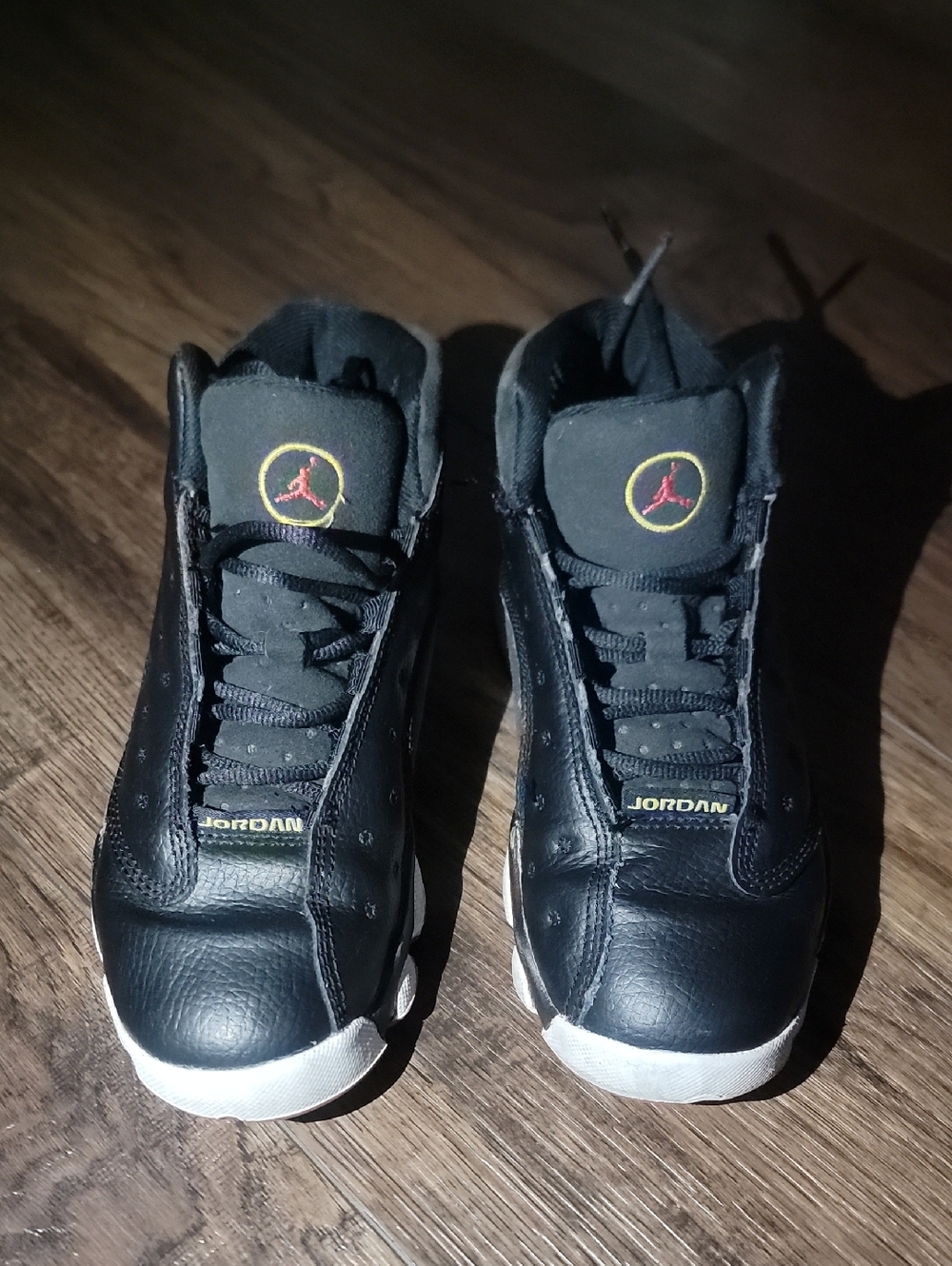 Jordan Black Retro Basketball Sneakers with Red and Yellow Logo